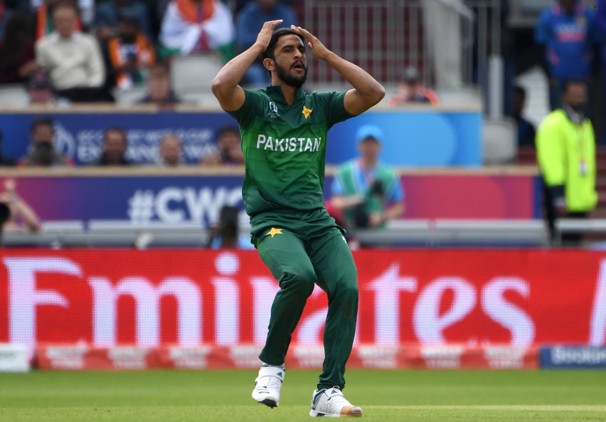 Hassan Ali reacts after being hit for a boundary. ─ AFP