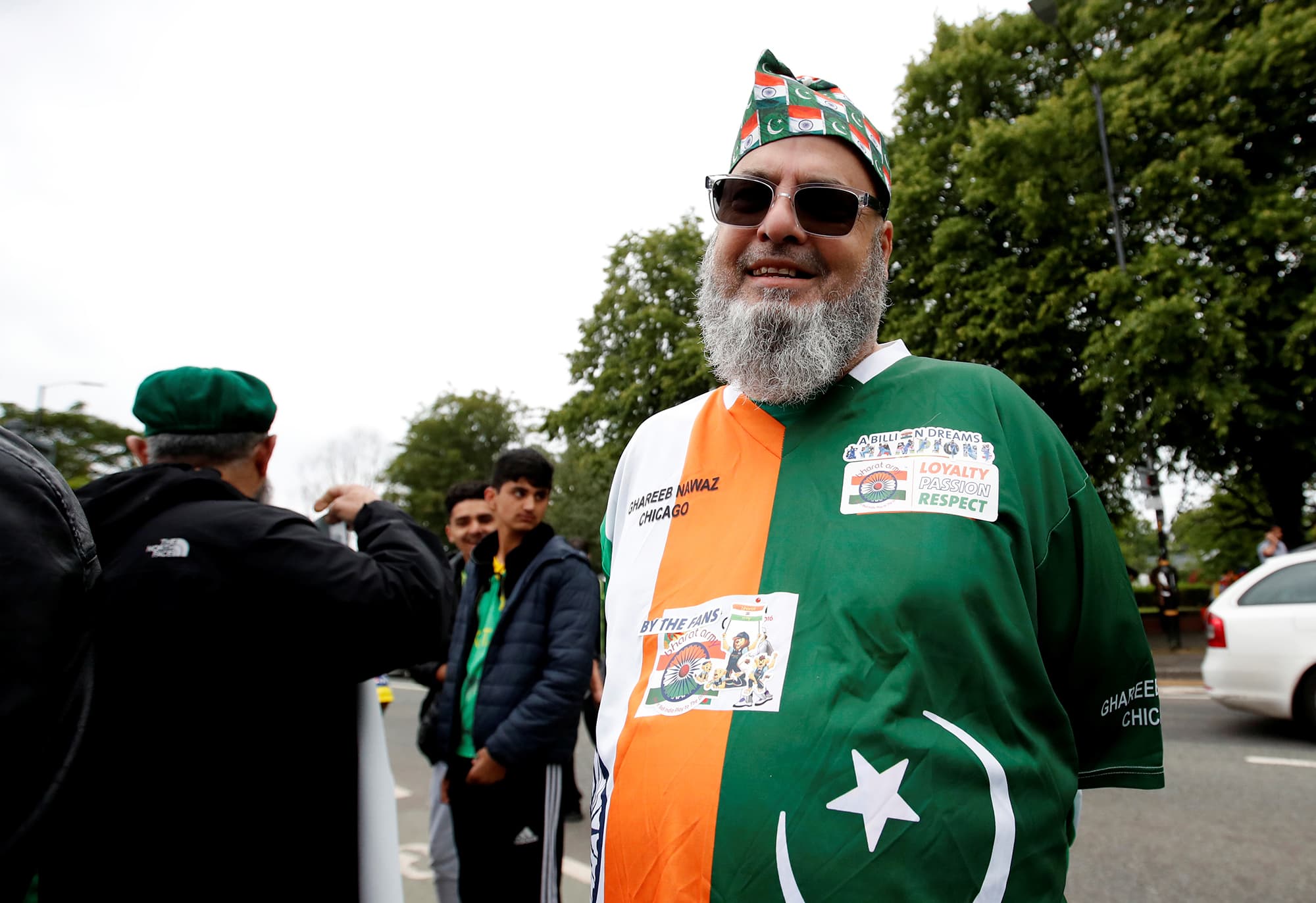 A rare supporter wearing Indian colours with the Pakistani flag's crescent-star superimposed on them outside the ground before the start of the match between India and Pakistan outside Old Trafford. ─ Reuters