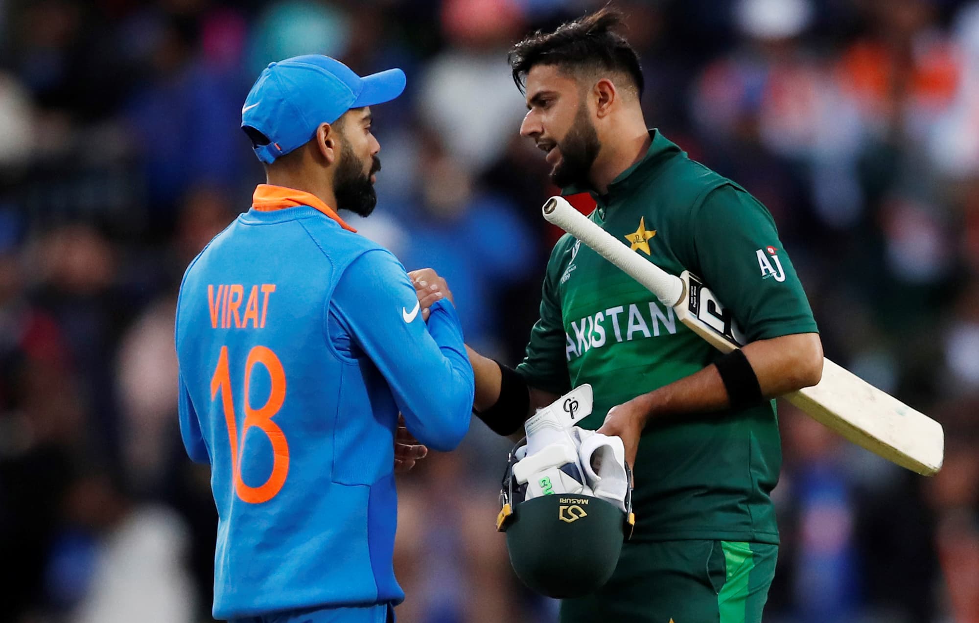 Virat Kohil shakes hands with Imad Wasim after the match. ─ Reuters