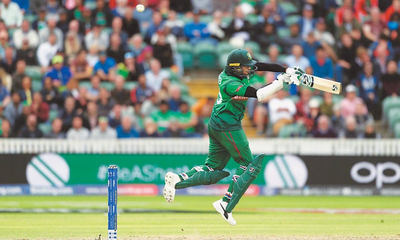 TAUNTON: Bangladesh batsman Shakib Al Hasan plays a shot during his century knock against the West Indies at the County Ground on Monday.—AP TAUNTON: Bangladesh batsman Shakib Al Hasan plays a shot during his century knock against the West Indies at the County Ground on Monday.—AP