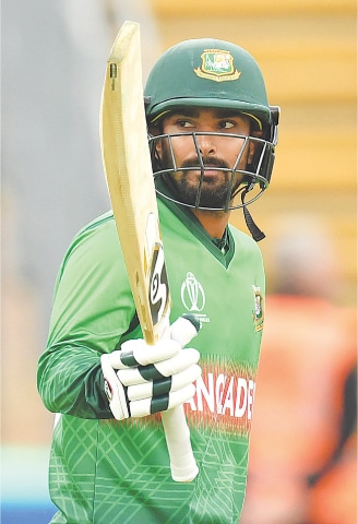 BANGLADESH batsman Liton Das celebrates after reaching his half-century on Monday.—AFP