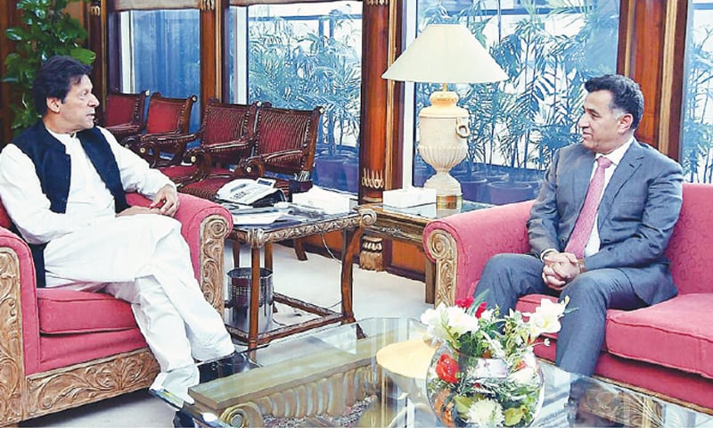 ISLAMABAD: Prime Minister Imran Khan speaks to ISI DG Lt Gen Faiz Hameed, who called on him at the PM Office on Tuesday.—APP