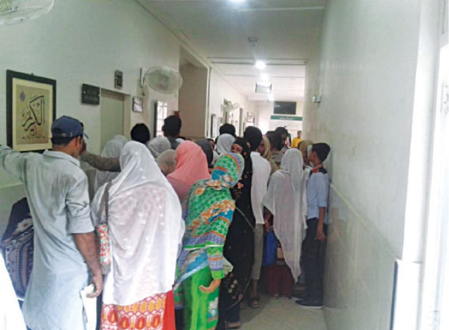 SIALKOT: A rush of patients and their attendants in a ward at the THQ Civil Hospital. &mdash; Dawn