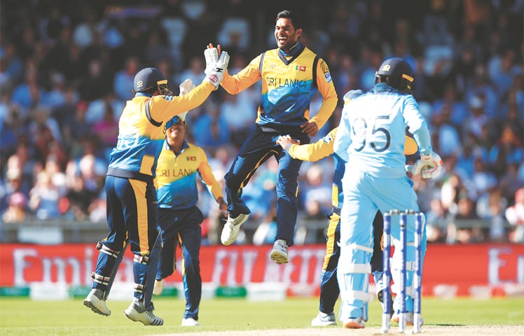 LEEDS: Sri Lankan spinner Dhananjaya de Silva celebrates with wicket-keeper Kusal Perera after dismissing England tailender Adil Rashid during their match at Headingley on Friday.&mdash;Reuters