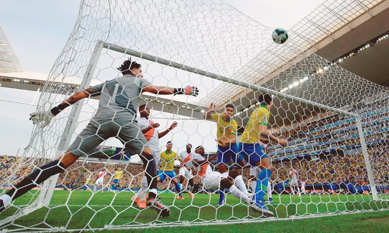 SAO PAULO: Brazil&rsquo;s Casemiro (second R) scores during the Copa America match against Peru at the Arena Corinthians.&mdash;Reuters