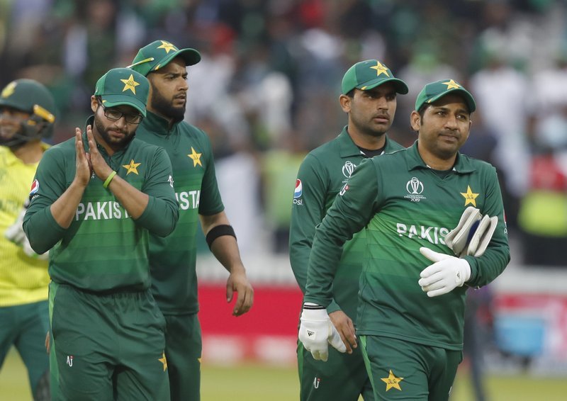 Sarfaraz Ahmed leads the team from the field as they celebrate after defeating South Africa by 49 runs. ─ AP