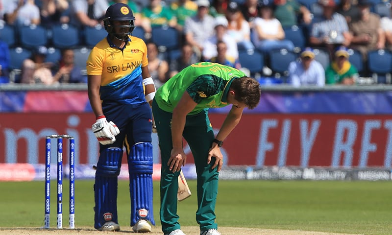 South Africa's Dwaine Pretorius (R) reacts after an unsuccessful appeal for the wicket of Sri Lanka's Avishka Fernando (L) during the 2019 Cricket World Cup group stage match between Sri Lanka and South Africa at the Riverside Ground on June 28. — AFP