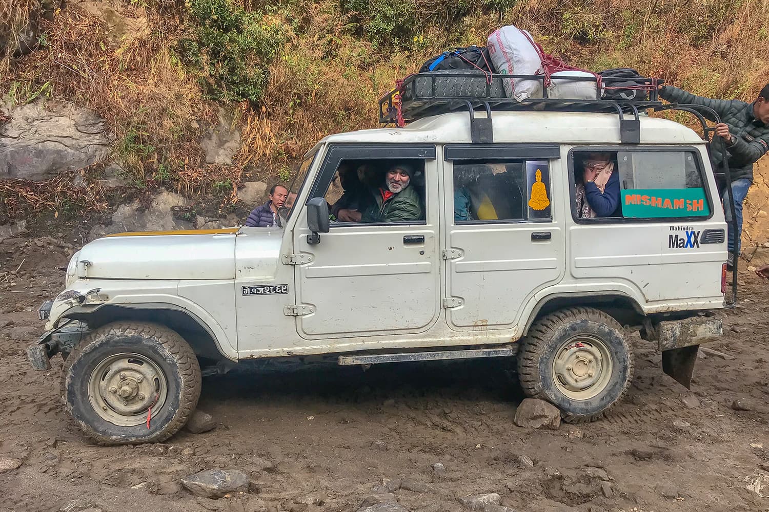 The drive back to Taplejung. There were 15 passengers in the cramped vehicle, four including the driver on the front seat.