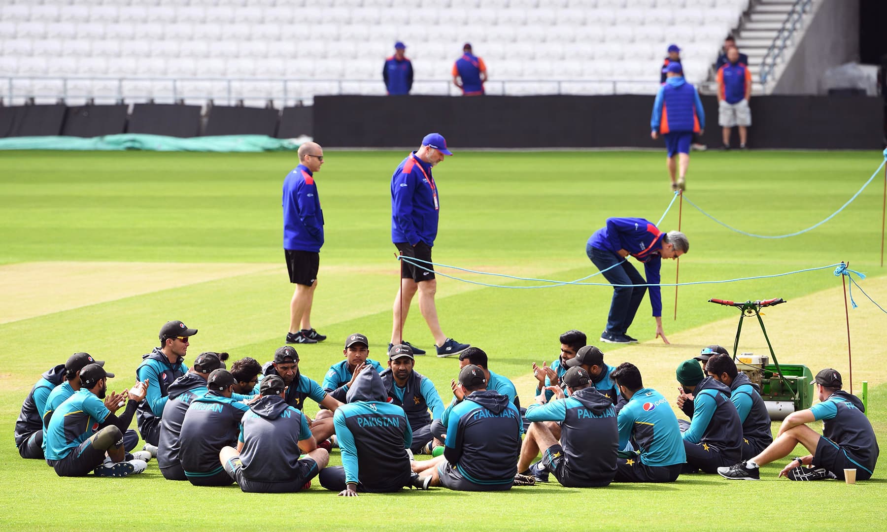 Skipper Sarfaraz Ahmed (C) speaks to his team on the field during a training session at Headingley in Leeds, northern England, ahead of their World Cup cricket match against Afghanistan on June 28. — AFP