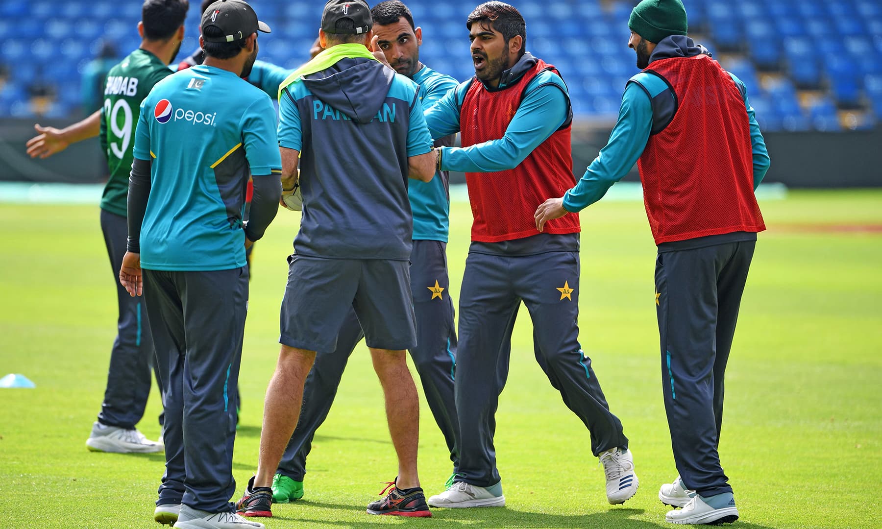 Team discussion during the training session at Headingly. — AFP