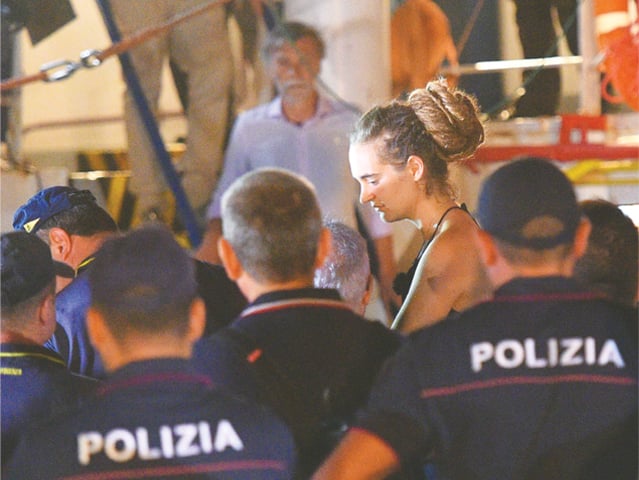 Lampedusa (Italy): Carola Rackete, the 31-year-old Sea-Watch 3 captain, is escorted off the ship by police and taken away for questioning on Saturday.—Reuters