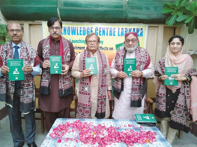 AUTHOR (extreme right) and guests hold copies of the book at the launching ceremony.—Dawn