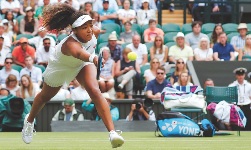 LONDON: Japan&rsquo;s Naomi Osaka plays a return to Yulia Putintseva of Kazakhstan during their Wimbledon match at the All England Lawn Tennis Club on Monday. &mdash; AFP