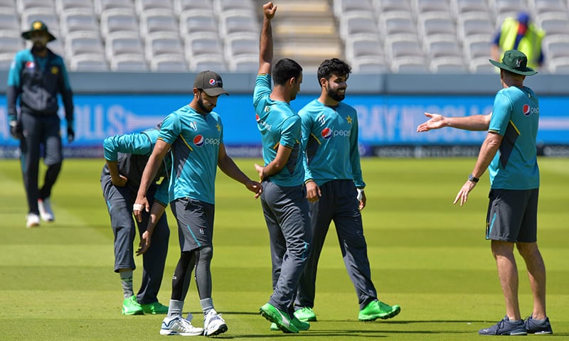 Imad Wasim (3L) and Shadab Khan (2R) attend a training session at Lord's cricket ground in  London on July 4, ahead of their World Cup group stage match against Bangladesh. — AFP