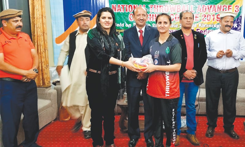 KHANISPUR: PRF general secretary Ume Laila Kulsoom presents the first prize to Sonia Shah who topped the throwball-rocball Advance III course held this week.