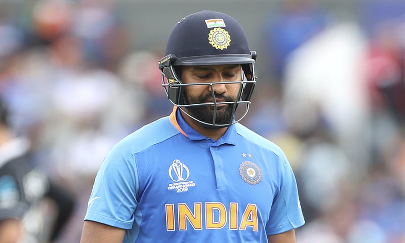 India's Rohit Sharma reacts as he leaves the field after being dismissed by New Zealand's Matt Henry during the Cricket World Cup semi-final match between India and New Zealand at Old Trafford in Manchester on July 10.— AP