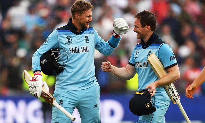 England's captain Eoin Morgan (R) and England's Joe Root celebrate victory at close of play during the 2019 Cricket World Cup second semi-final between England and Australia at Edgbaston in Birmingham, central England,  on July 11. — AFP