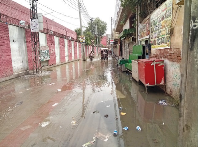 CHINIOT: Rainwater and sewage have inundated a road in the city. — Dawn