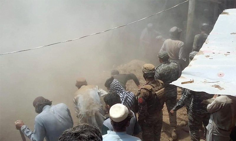 Locals sift through the rubble to look for bodies and survivors after a roof collapse in Leera area of Orakzai tribal district on Thursday. — Online