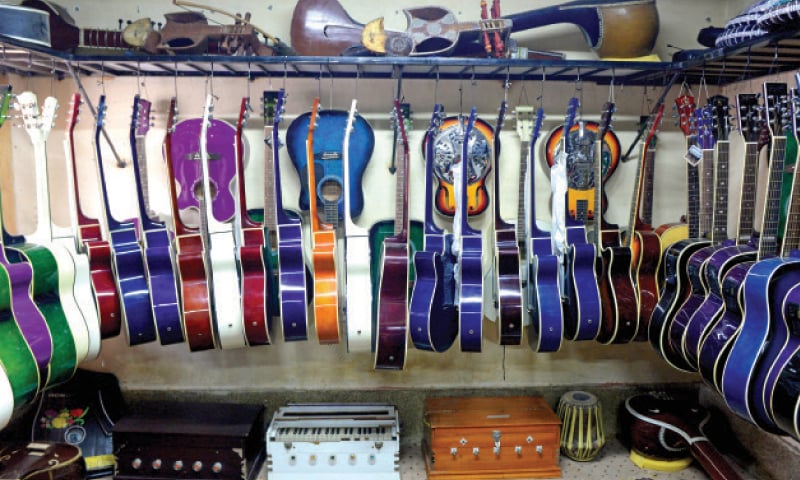 A wide selection of guitars on display at a shop in Sur Gali.