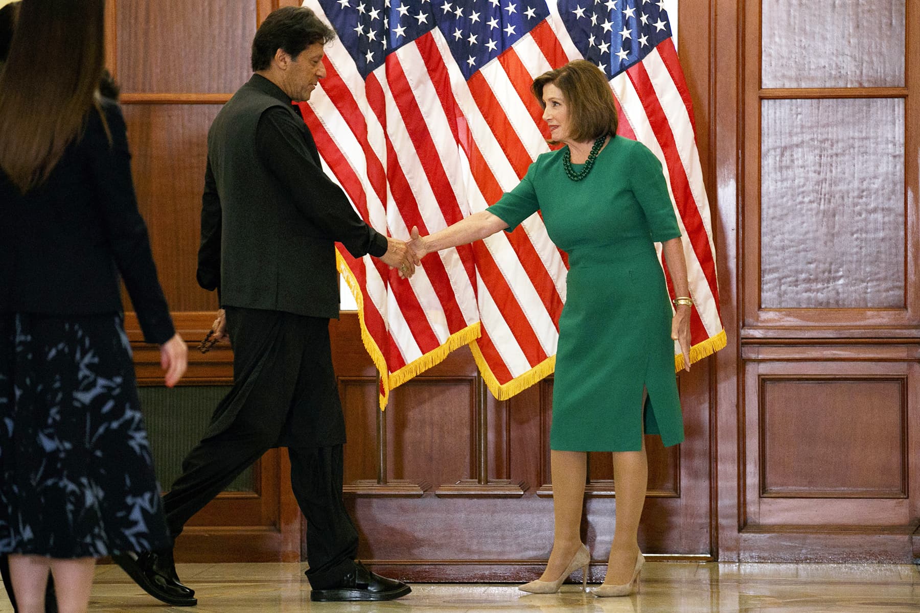 House Speaker Nancy Pelosi of California shakes hands with PM Imran on July 23 at Capitol Hill in Washington. — AFP