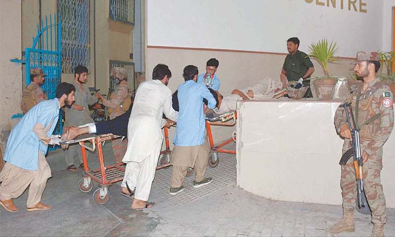 QUETTA: Rescue workers shifting injured persons to hospital after the bomb explosion. — INP/File