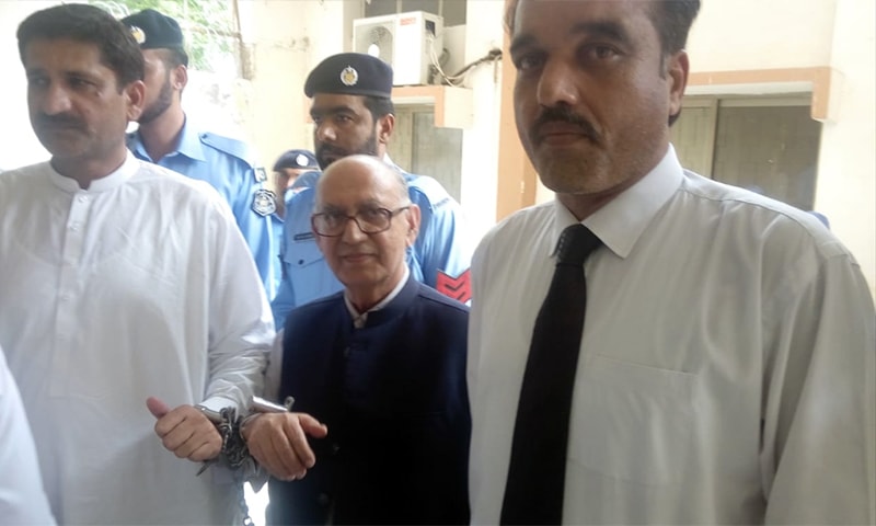 Irfan Siddiqui (C) is presented before a magistrate in handcuffs on Saturday. — Photo by author