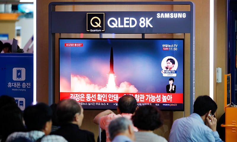 People watch a TV that shows a file picture of a North Korean missile for a news report on North Korea firing short-range ballistic missiles, in Seoul, South Korea on July 31. &mdash; Reuters