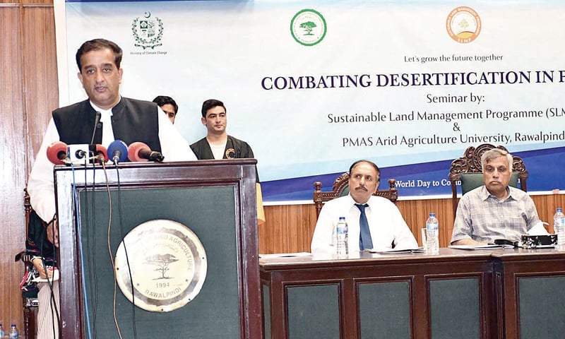 Adviser to the Prime Minister on Climate Change Malik Amin Aslam speaks at the seminar at the PMAS Arid Agriculture University on Wednesday. &mdash; APP