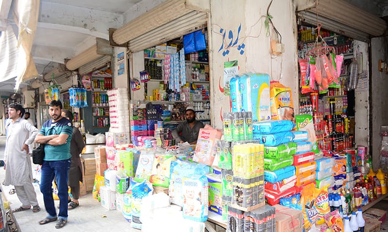 A small trader pictured in a Peshawar market. — Salman Yousafzai‏/File