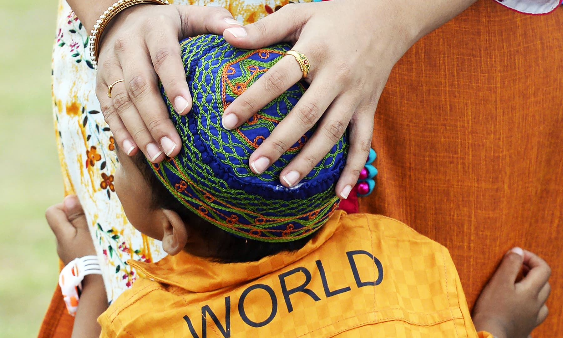 A young boy looks on during the Eidul Azha festival in Colombo on Monday. &mdash; AFP