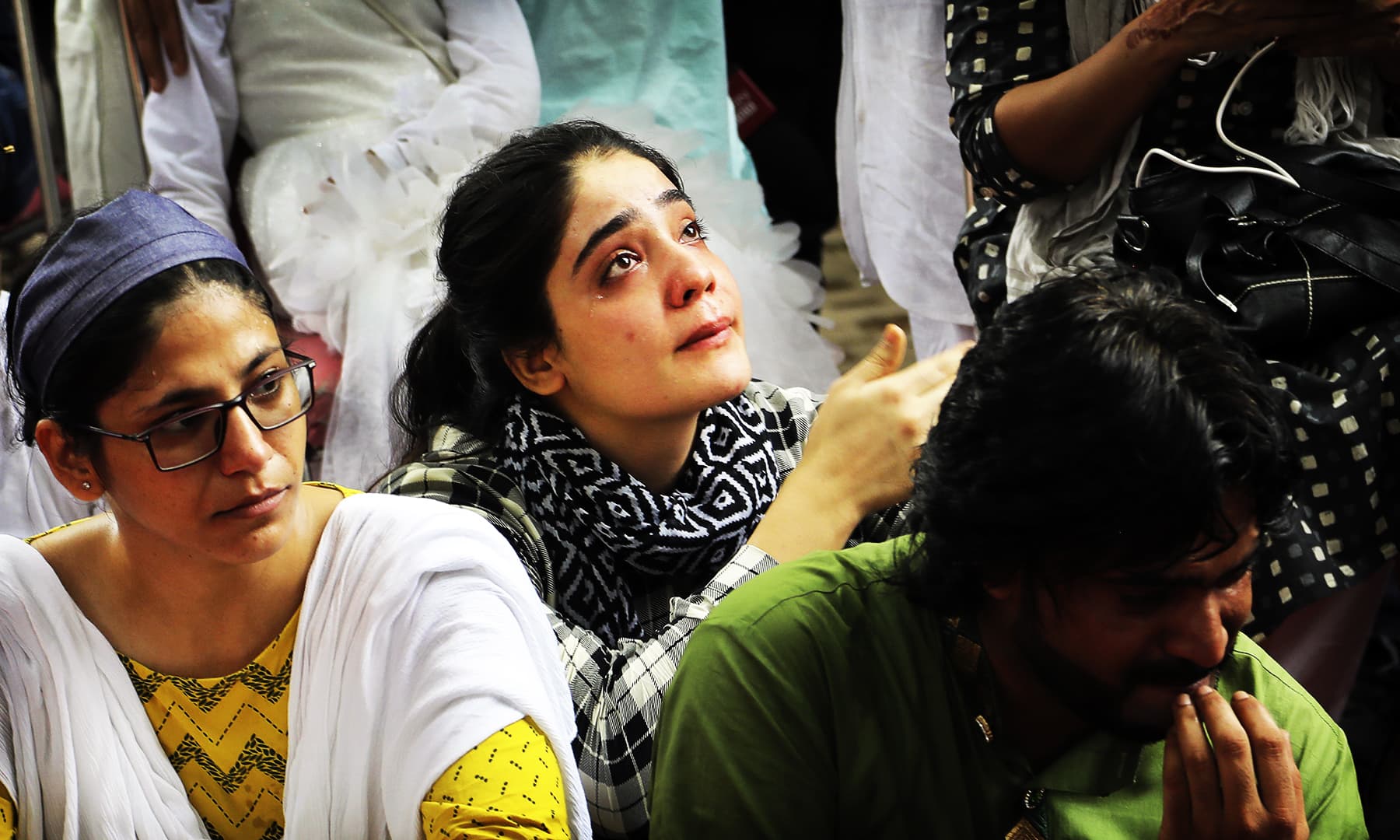 A Kashmiri woman breaks down after listening to a fellow Kashmiri narrating memories of the past Eid in the valley. &mdash; AP