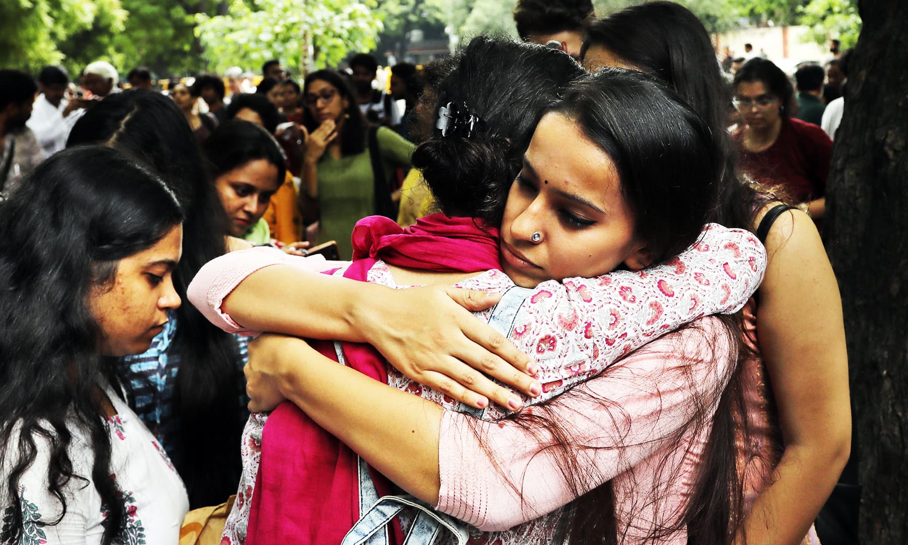 A Kashmiri woman consoles another who broke down as Kashmiris living in New Delhi gather for a function to observe Eidul Azha. &mdash; AP