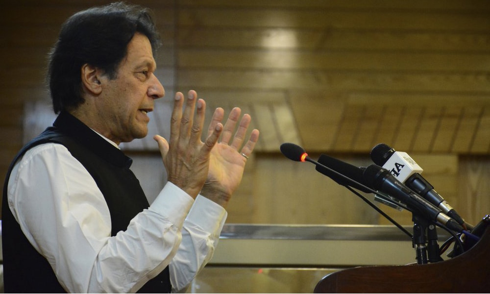 Prime Minister Imran Khan addresses Azad Jammu and Kashmir's legislative assembly on the occasion of Pakistan's Independence Day, in Muzaffarabad, on Wednesday. — AP