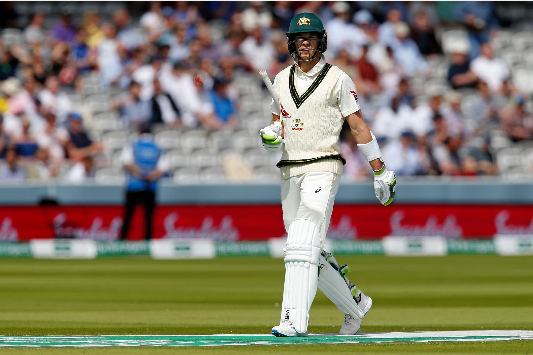 Australia's captain Tim Paine walks back to the pavilion after losing his wicket. — AFP