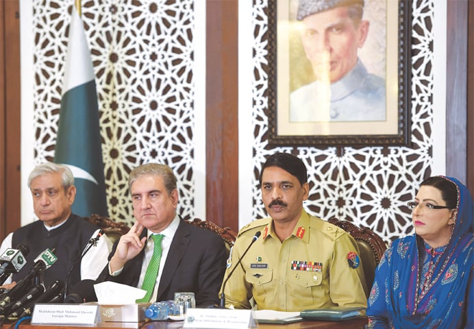 ISLAMABAD: (from left) Chairman of the Parliamentary Kashmir Committee Fakhar Imam, Foreign Minister Shah Mehmood Qureshi, director general of the ISPR Maj Gen Asif Ghafoor and Special Assistant to the PM Firdous Ashiq Awan addressing a press conference at the foreign ministry on Saturday.—Tanveer Shahzad / White Star