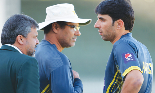 In this 2014 file photo, then-Pakistan coach Waqar Younis (C) talks with then-captain Misbah-ul-Haq (R) at the Sharjah Cricket Stadium. â AFP