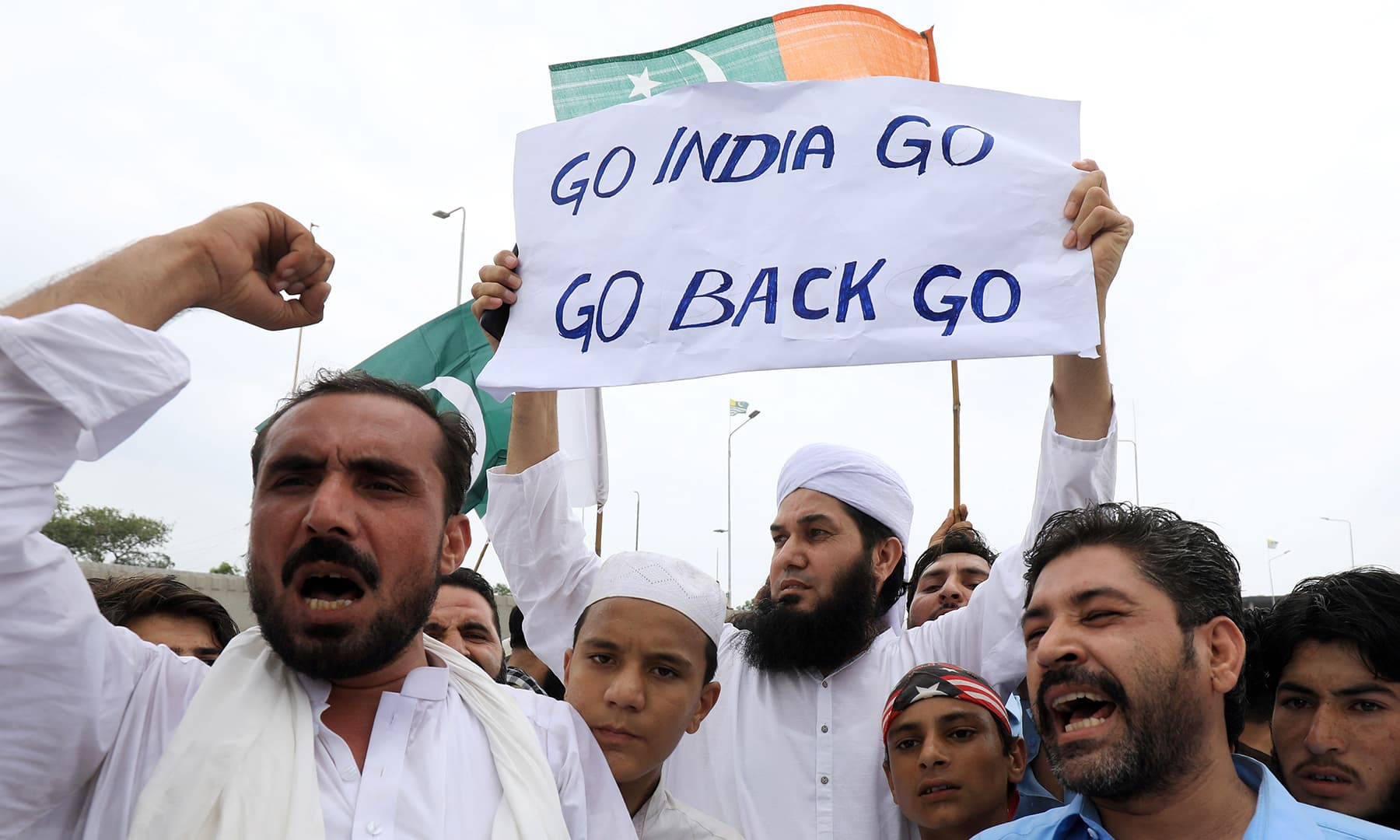 People chant slogans during a countrywide 'Kashmir Hour' demonstration to express solidarity with the people of Kashmir, in Peshawar. — Reuters