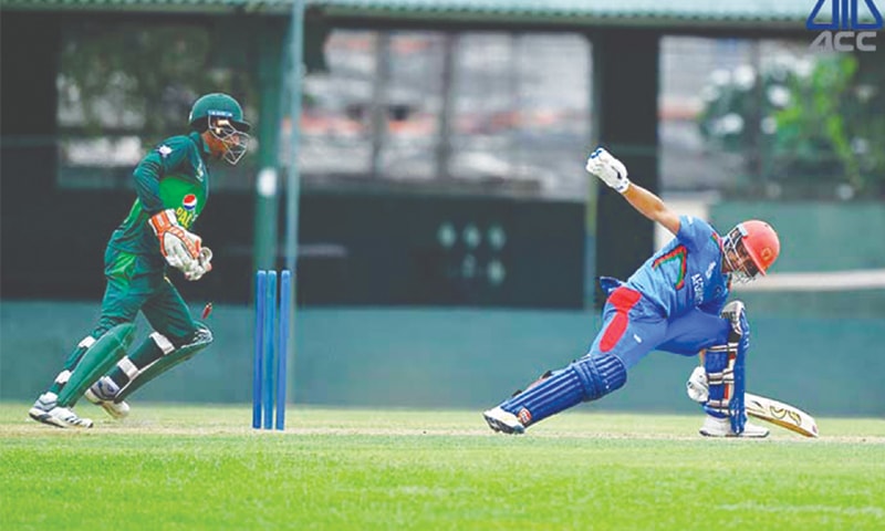 COLOMBO: Afghanistan&rsquo;s Asif Musazai is stumped by Pakistan captain Rohail Nazir during their U-19 Asia Cup match at the P. Sara Oval on Thursday.&mdash;courtesy ACC