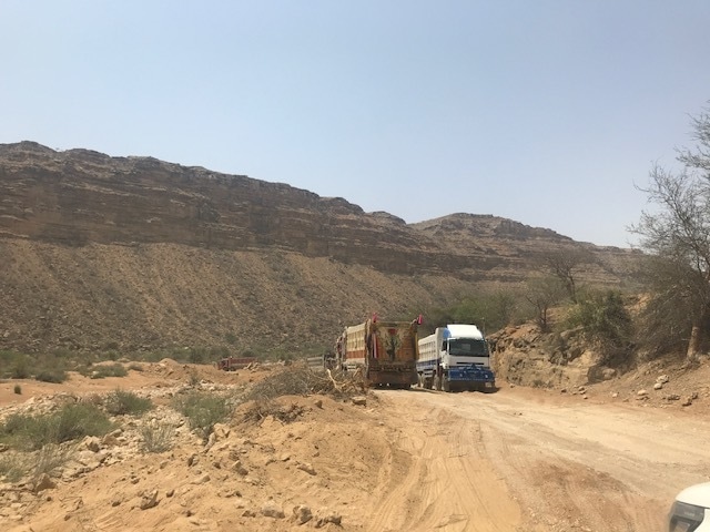 Dumpers going to and fro lifting sand from the Mole naddi riverbed. —White Star