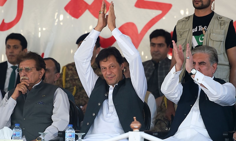 PM Imran Khan, accompanied by AJK PM Raja Farooq Haider and FM Shah Mahmood Qureshi. — AFP