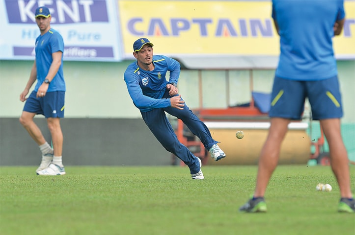 DHARAMSALA: South Africa captain Quinton de Kock (C) throws a ball during a practice session at the HPCA Stadium on eve of the first T20 International against India.—AFP