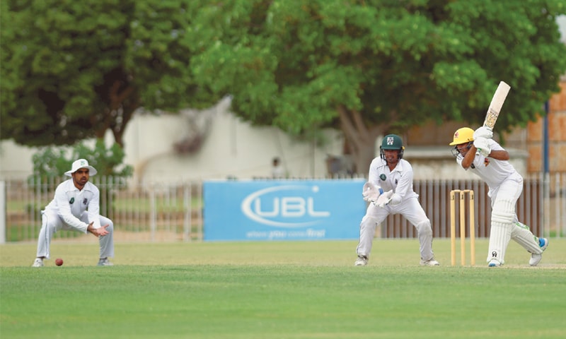 KARACHI: Sindh opener Abid Ali plays a cover drive during his undefeated double century during the Quaid-i-Azam Trophy match against Balochistan at the UBL Sports Complex on Sunday. — Tahir Jamal/White Star