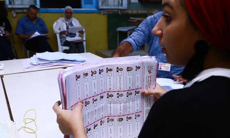 Tunisian volunteers count ballots at a polling station in Sousse, south of the capital Tunis, on September 15. &mdash; AFP