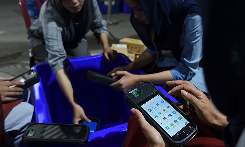 In this photo taken on September 16, an Afghan employee of the Independent Election Commission (IEC) prepare ballot boxes for the upcoming presidential election at a warehouse in Kabul. — AFP