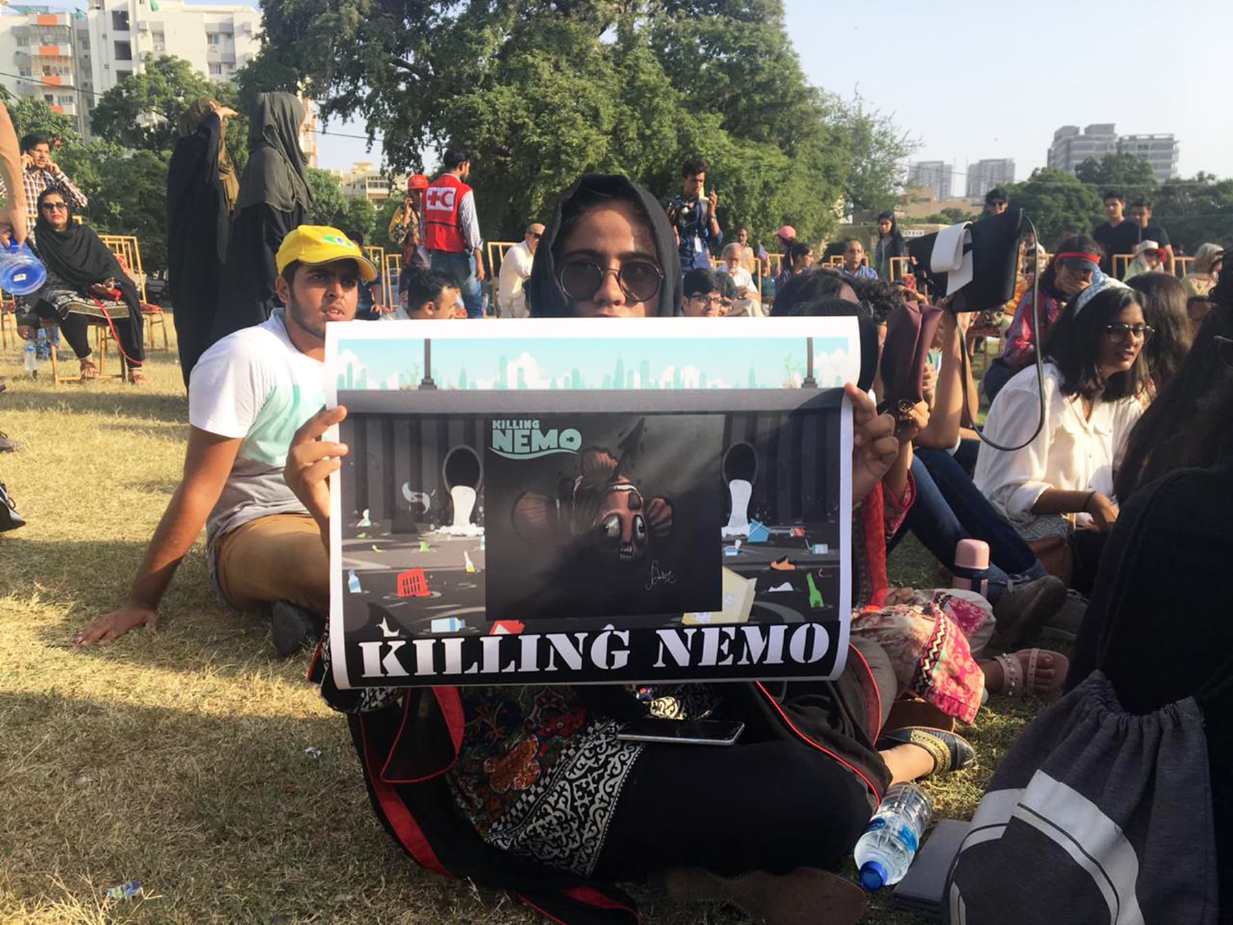 A protestor in Karachi displays a sign "Killing Nemo" highlighting the menace of sea pollution that has swept the globe. — Sana Ali