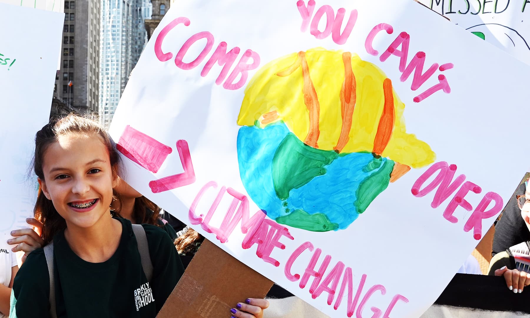 Another student holds up a sign during the Global Climate Strike march at Foley Square in New York.1 AFP