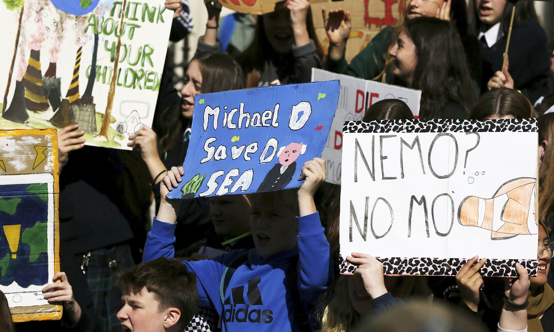 Students hold banners during a climate protest in Dublin, Friday, Sept. 20, 2019. — AP