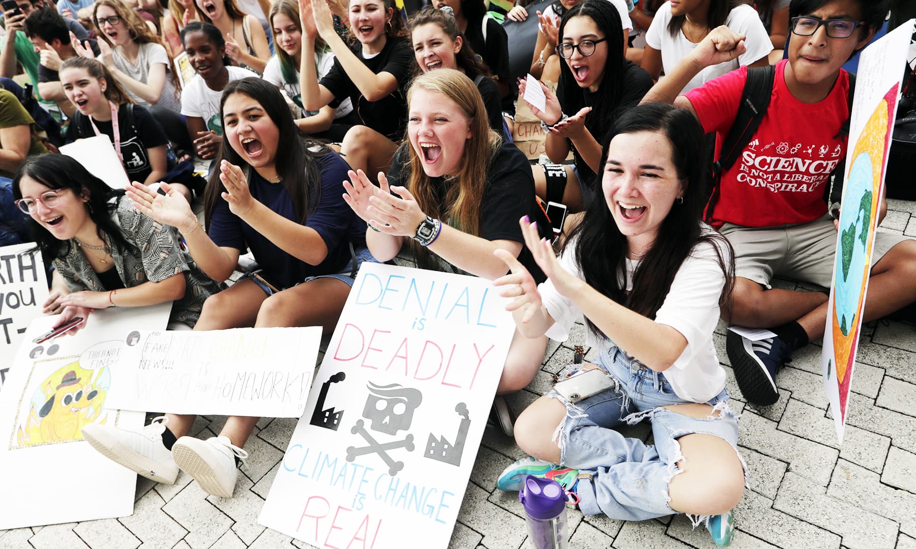 Students cheer during a protest organized by the US Youth Climate Strike outside of Miami Beach City Hall, as part of a global day of climate action. — AP