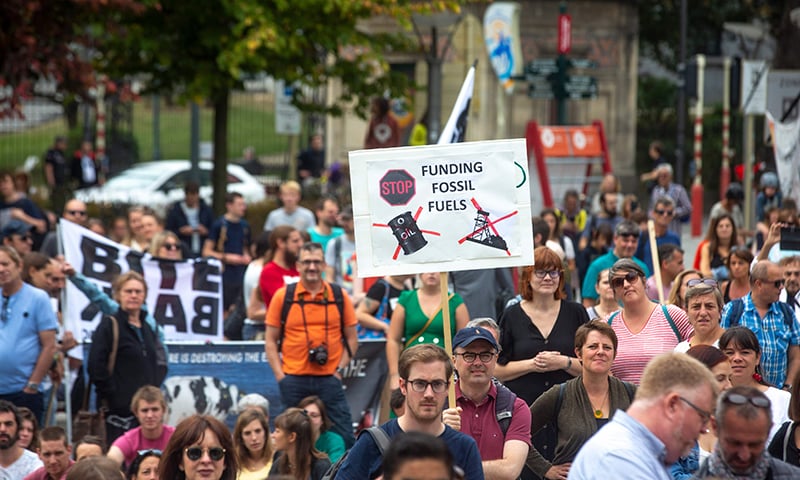 People take part in a demonstration for the climate called 'Act Now or Never' to raise awareness for climate change, organised by 'Rise for Climate Belgium', in on September 22, 2019 in Brussels. &mdash; AFP
